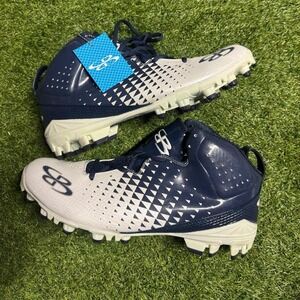 Navy and white Under Armour football cleats #football #cleats